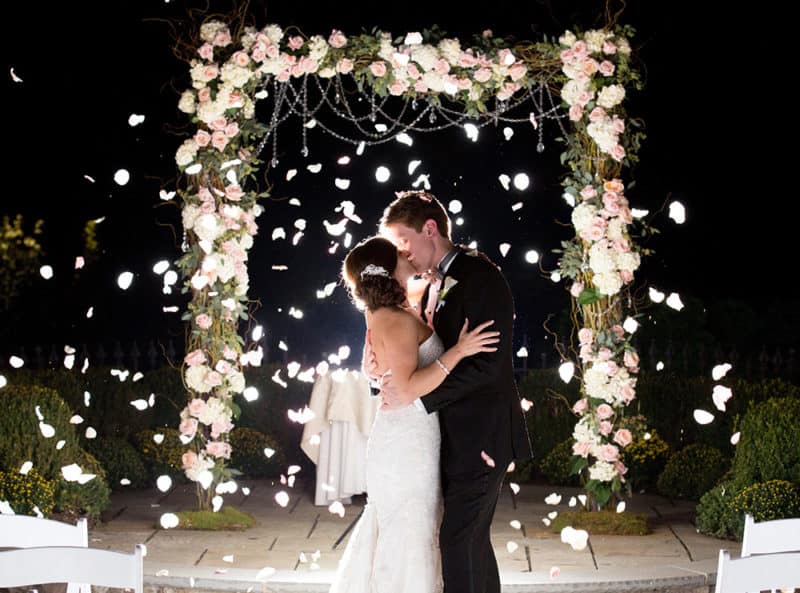 Amanda and Andrew at their outside ceremony at the Park Savoy in Florham Park. Drew Noel Photography