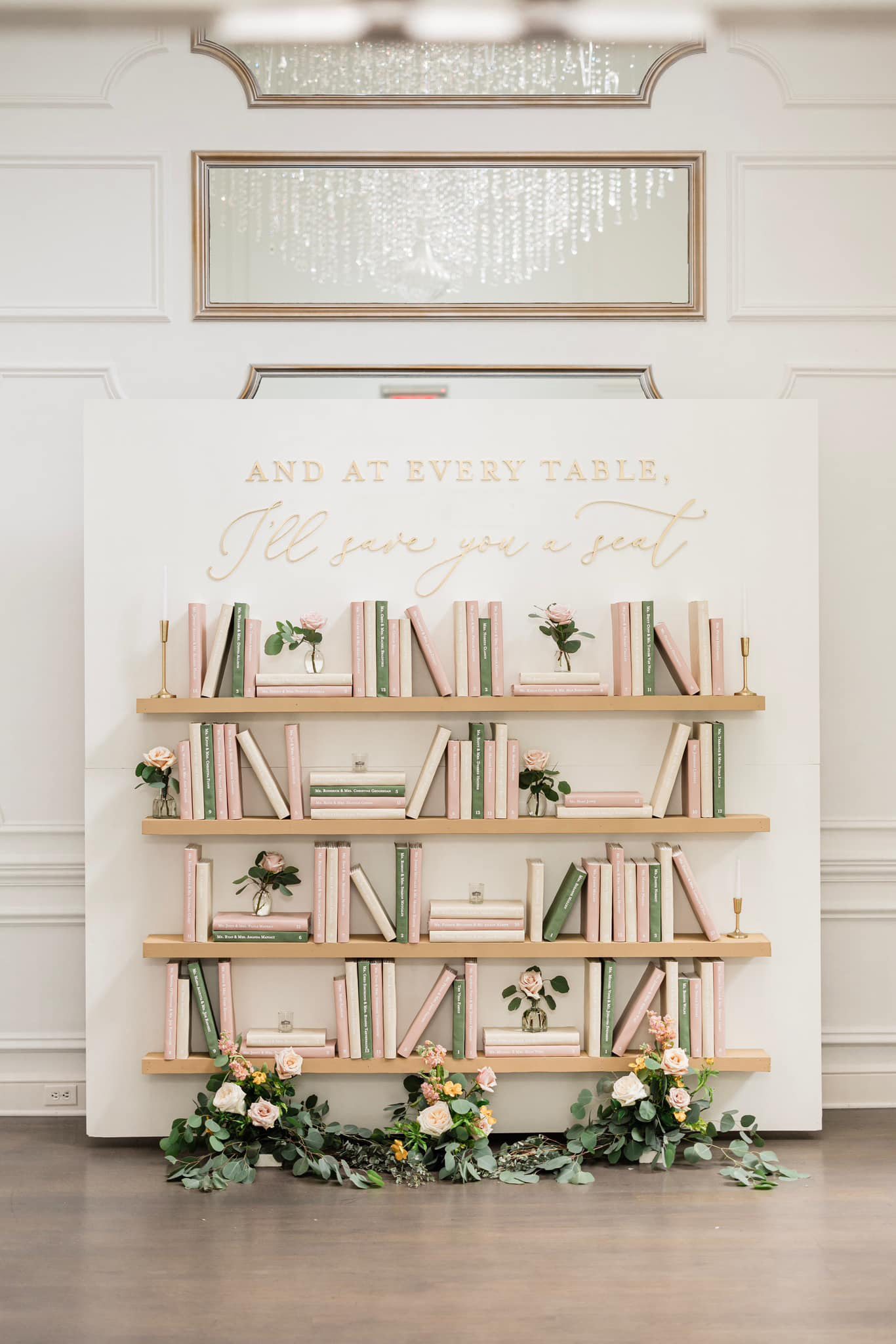 This bookcase seating chart is a fun wedding decor idea.