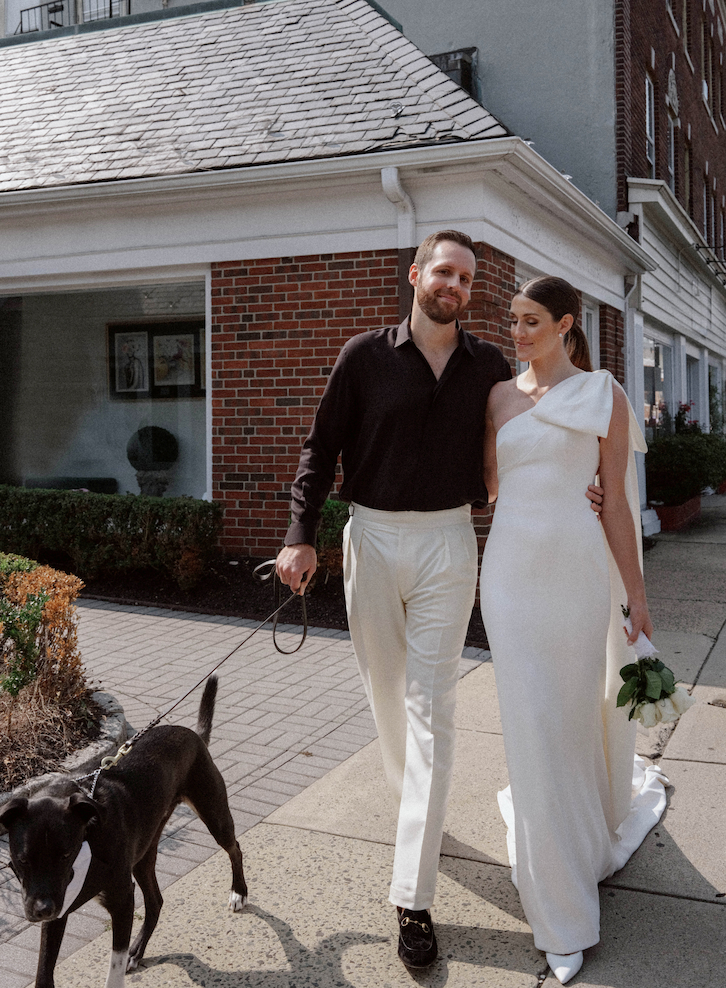 Justin Alexander Warshaw and Kelsey Turchi had a micro-ceremony in Westfield, New Jersey. While in their wedding outfits, they took a stroll around town with their dog, Irving.
