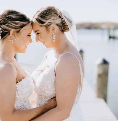 The wedding of A Waterfront Wedding Featuring The Couple’s Dog & Pride Flags at the Ceremony