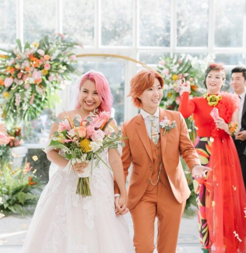 The wedding of A Tropical Vibe Wedding Filled With Yellow, Orange and Pink Florals