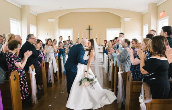 The wedding of Thrifted Candlestick Holders And Frames Added a Vintage Vibe to Their Hotel Wedding at The Shore A wedding at Breakers on the Ocean. Gallery 2