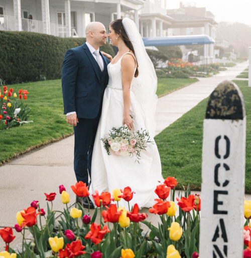 The wedding of Thrifted Candlestick Holders And Frames Added a Vintage Vibe to Their Hotel Wedding at The Shore A wedding at Breakers on the Ocean.